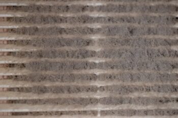 Very Dirty And Dusty White Plastic Ventilation Grill. Ventilation Shaft In The Apartment. Dirty Air Filter. House Cleaning Concept.