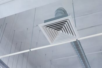 Supply And Exhaust Ventilation System On Ceiling Of A Commercial Room Or Warehouse