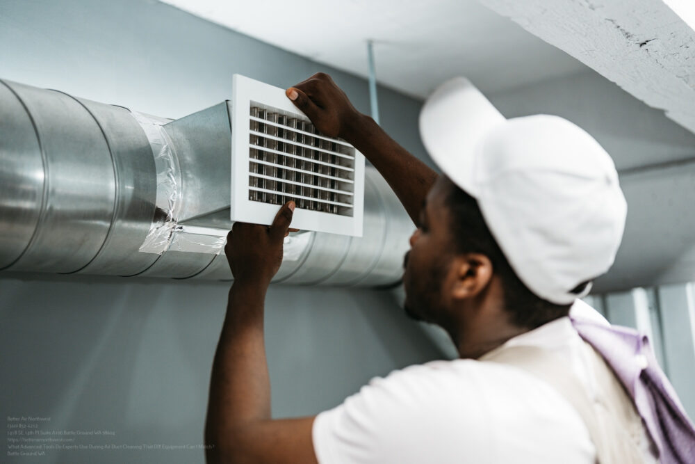 Worker Installing Air Duct Vent In A Residential Basement During The Day
